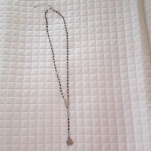 Cute black beaded necklace with silver toned accen